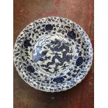 A Chinese porcelain large blue & white bowl with dragon design. Measures 63cm in diameter