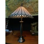 A Contemporary Tiffany style table lamp. In a working condition.