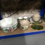 A Shelf of Scottish pottery which includes Wemyss ware style cup and saucer, Scottish made green