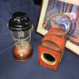 A Vintage Tilley storm lamp together with a railway signal lamp.