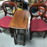 A Pair of Balloon back chairs together with a drop end table with barley twist support legs.