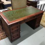 A Lovely example of a Victorian knee hole desk, Rustic green leather top, Measures 73x138x70cm. (