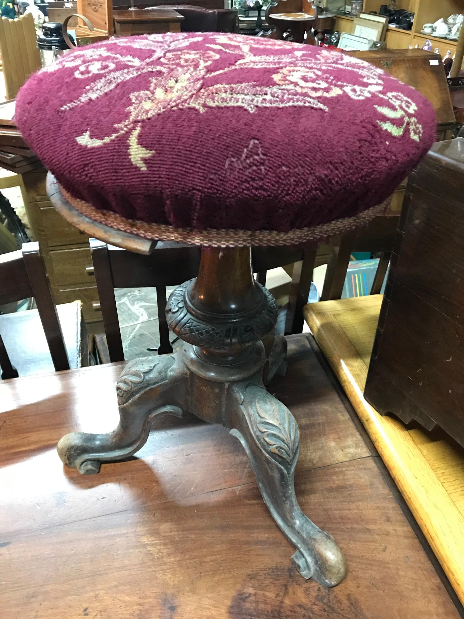 A Victorian pedestal rise and fall piano stool.
