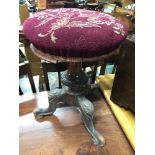 A Victorian pedestal rise and fall piano stool.