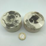 A Lot of two Japanese Meiji period ivory preserve pots with etched Lion, tiger and elephant tops.