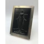 A German 835 Silver art deco style frame with a hand carved piece of slate depicting St. Barbara