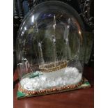 A Large early 1900's Nailsea spun glass sailing ship in a dome display. Displaying hand blown ship