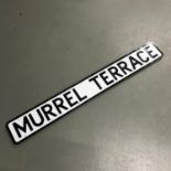 A Burntisland Street sign "Murrel Terrace" made from metal and has a bracket to the back. Measures