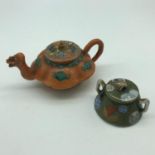 A 19th century orange and green hand painted miniature tea pot set with a dragon head spout.