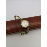 A Ladies vintage 9ct gold cased and 9ct gold strap Tatton 15 jewels watch. In a working condition.