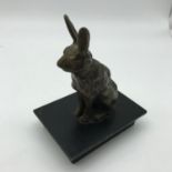 A Bronze hare/rabbit figure on stand.
