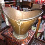 Antique copper coal bucket. In the shape of a helmet.