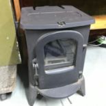 A Good quality wood burning stove as new. Very heavy. Measures 56x38x50cm