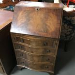 A ladies four drawer writing bureau