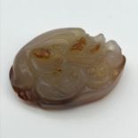 A Chinese hand carved Agate Jade sculpture of a foo dog [6.8cm in length]