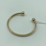 A 9ct gold bangle. Weighs 3.7grams