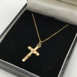 A 9ct gold chain together with a 9ct gold crucifix. Total weight 2grams