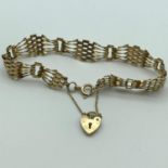 A Ladies 9ct gold bracelet with heart charm. Total Weight 6.1Grams