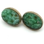 A Pair of Chinese hand carved jade and gilt metal clip on earrings.