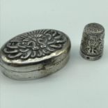 An 800 Grade silver Persian pill box, lid is detailed with two peacocks with feathers spread,