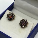 A Pair of ladies antique 9ct gold and garnet cluster earrings. Weighs 2.2grams.