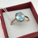 A 9ct gold ladies ring set with a large Aqua marine style stone, ring size Q [Total weight 2.2grams]