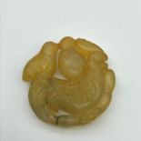 A Hand carved Chinese jade sculpture of Chicken and chicks [4.7cm in diameter]