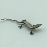 Antique silver lizard sculpture detailed with ruby eye. [length 7cm]