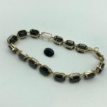 A Lovely example of a ladies 10ct gold and Sapphire gem stone bracelet. 15 Genuine Sapphire gem