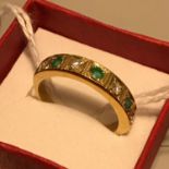 A Beautiful Antique 18ct gold ladies ring set with 4 diamonds and 3 emeralds. Ring Q and weighs 5.