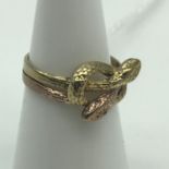 An unusual two tone double snake head ring, marked 333, Ring size K and weighs 2.9grams