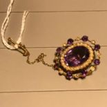 A Beautiful Victorian 9ct gold brooch set with a large Amethyst centre stone surrounded by seed