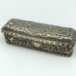 A Birmingham silver rectangular ornate patch box. Makers Thomas Hayes and dated 1898. Measures