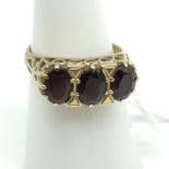 A Lovely example of a ladies 9ct gold ring set with three large garnet stones. Ring size N and