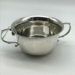 A Chester silver two handle Porringer. Maker Stokes & Ireland Ltd. Dated 1909. Weighs 165grams.