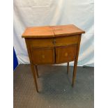 A Regency pedestal sewing table. Has a lift up two section top revealing a fitted interior, The