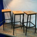 A Lot of three vintage wood and metal class room stools.