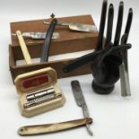 A Lot of four antique cut throat razors together with a vintage Turham Tuplex razor.