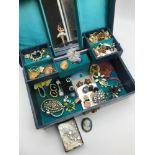 A Vintage jewellery box containing a quantity of vintage costume jewellery to include clip on