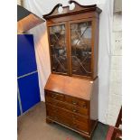 A Victorian mahogany bureau bookcase, Comes in two sections. Top half is designed with glass panel