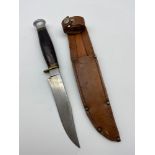 A Vintage J.H.Thompson hunting knife with leather sheath.