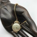 A Vintage ladies 9ct gold Tissot wrist watch with 9ct gold strap, 17 jewels movement serial number