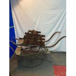 A 19th century children's twin Stroller/ rickshaw carrier. Could be used as a prop for staging or