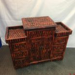 A Reproduction oriental bamboo effect cabinet. Measures 71x87x34cm