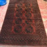 A Large antique hand made Persian rug. Measures 264x164cm