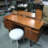A retro G-Plan teak pedestal dressing table set with a three way mirror. Comes with a Sherborne