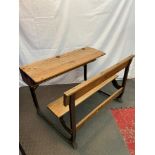 An early 1920's Kingfisher ltd oak and cast metal double school desk. Has a lift top desk area, Also