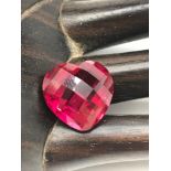 A 1950'S Man made ruby gem stone hand carved into a heart. Measures 1.4x1.4x0.9cm