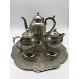 A 20th century Islamic style etched tea service with matching tray.