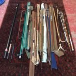 A Large collection of vintage fishing rods to include cane and graphite rods. Includes Graphite